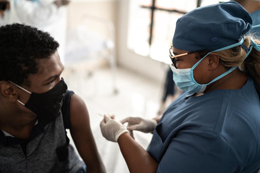 Teen getting a shot at the doctor