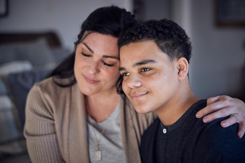 Mother and son hugging