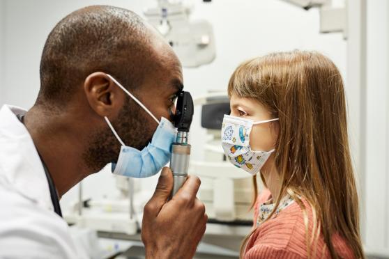 A child with a doctor for a routine checkup.jpg